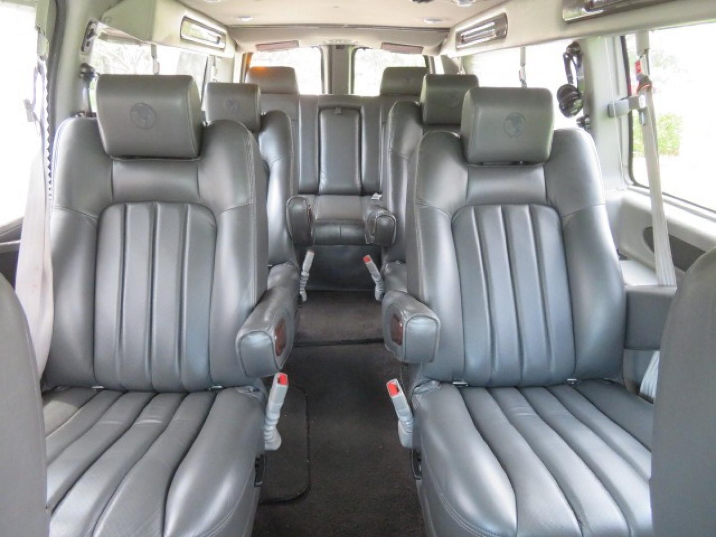 2014 Chevrolet Express (1GBWGLCG3E1) , located at 4301 Oak Circle #19, Boca Raton, FL, 33431, (954) 561-2499, 26.388861, -80.084038 - You are looking at a Rare 2014 Chevy Express 2500 Quigley 4x4 Four Wheel Drive Explorer Limited SE 9 Passenger Conversion Van with: 107K Original Miles, 6 Captain Chairs, Rear Power Folding Bench Seat Bed, Center Consoler Cooler, Front PPF (Paint Protection Film) Explorer Limited Conversion Througho - Photo#55